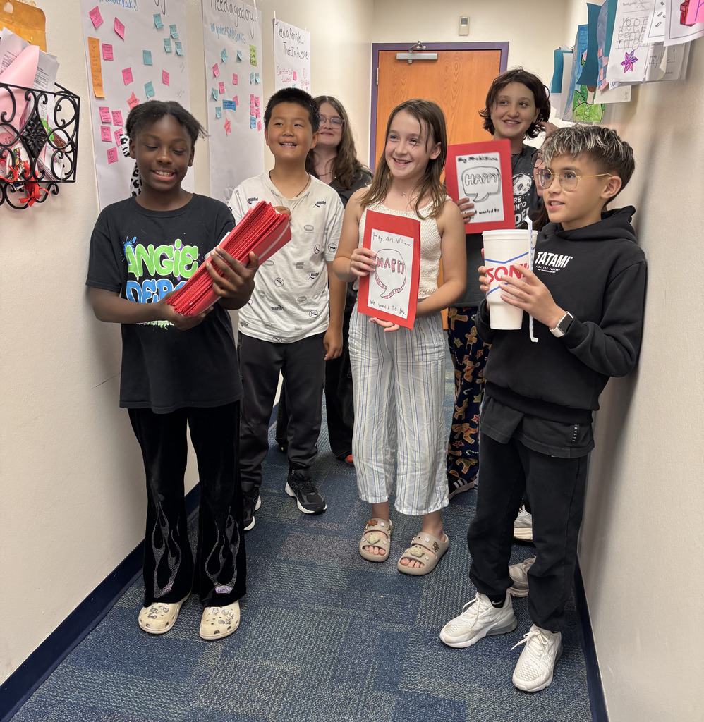 fifth grade students with cards and a sonic drink for mrs williams 