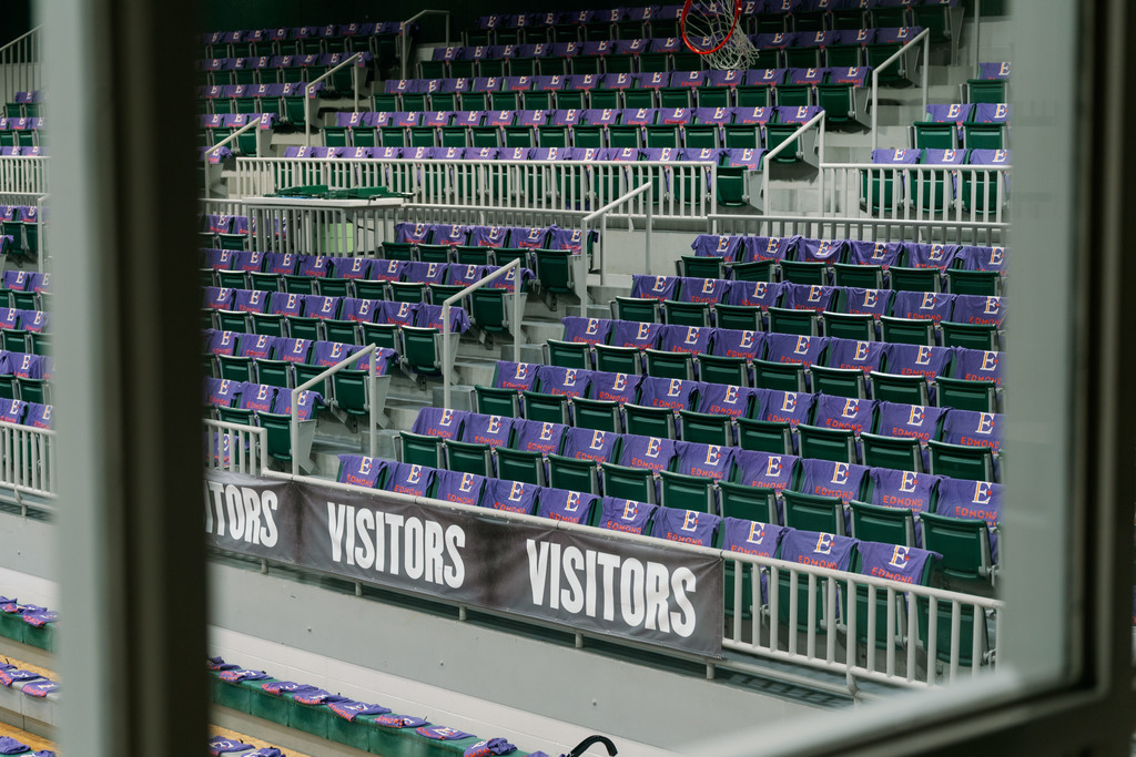 shirts set up on chairs in a gym