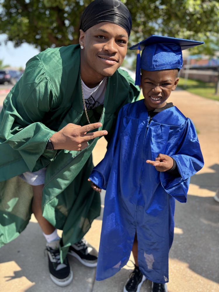 high school senior and pre-k graduate posing together 