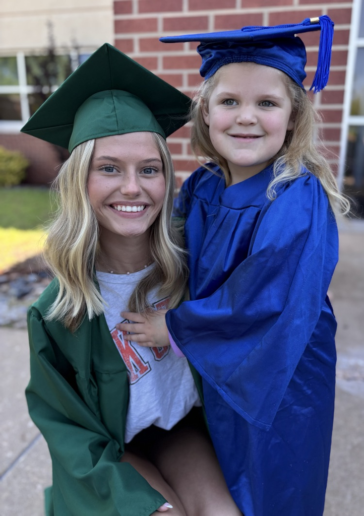 high school senior and pre-k graduate posing together 