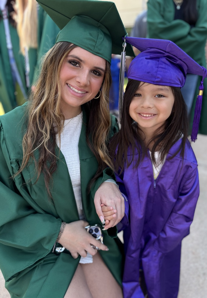 high school senior and pre-k graduate posing together 