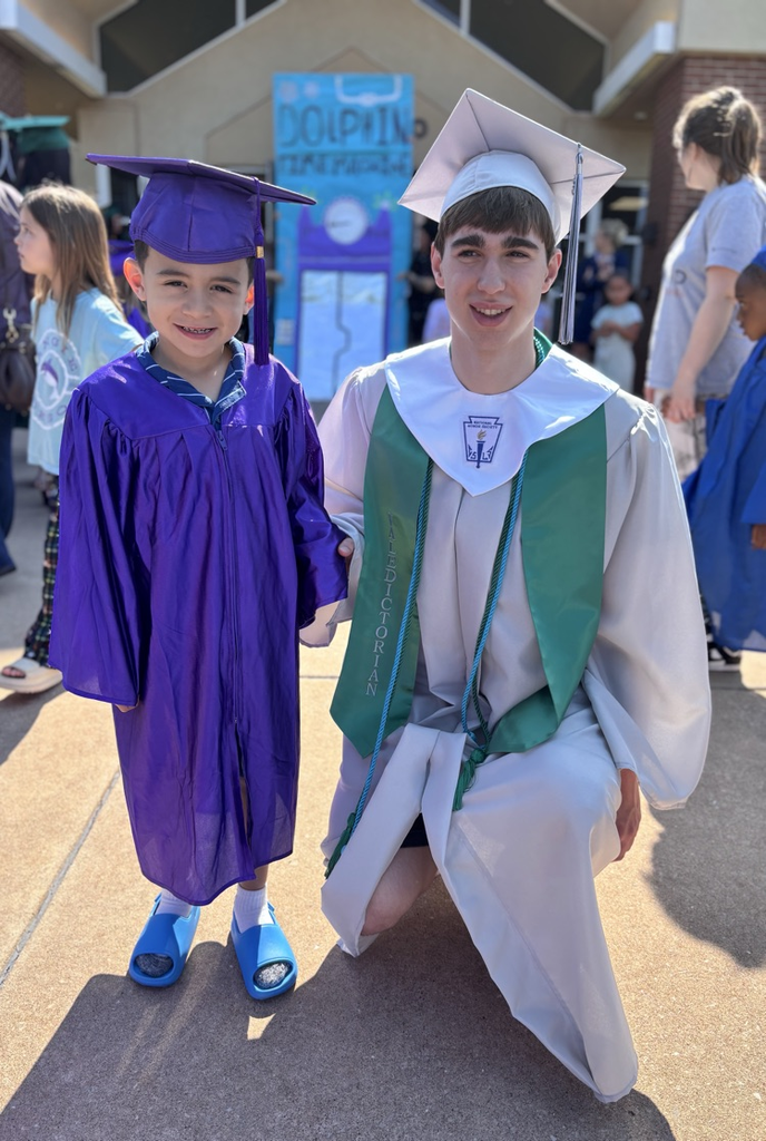 high school senior and pre-k graduate posing together 
