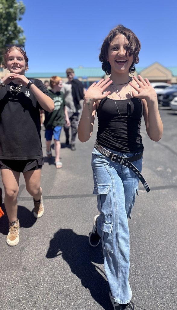 fifth grade girl walking during graduation clap out 