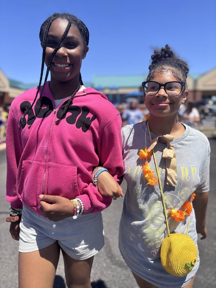 fifth grade friends walking together during graduation clap out 