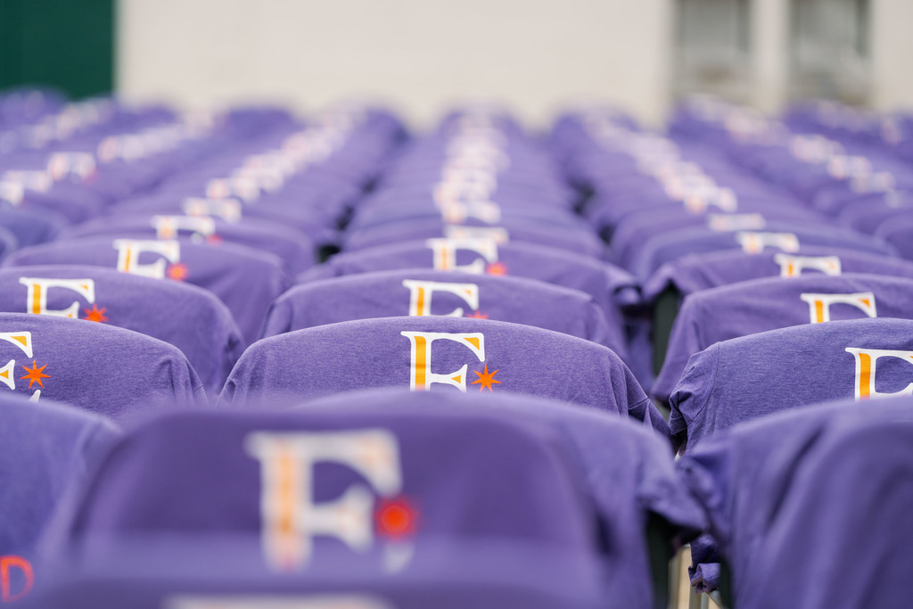 shirts set up on chairs in a gym
