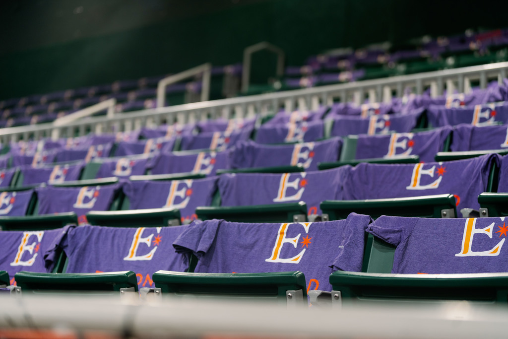 shirts set up on chairs in a gym