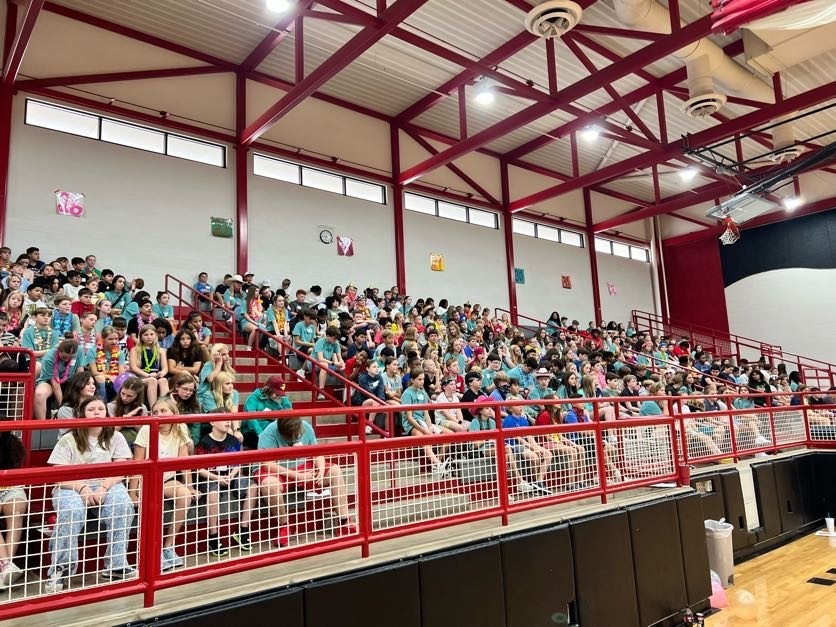students sitting in bleachers