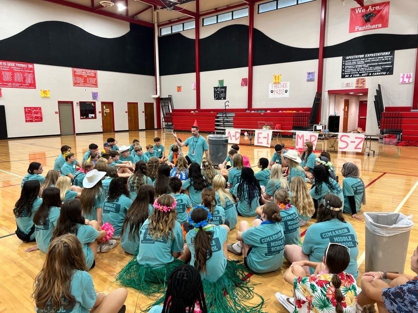 students listening to a leader