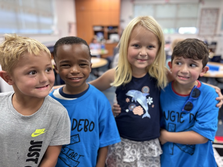 blue team kids lined up getting ready for the day 