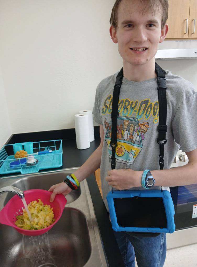 an intern washing lettuce