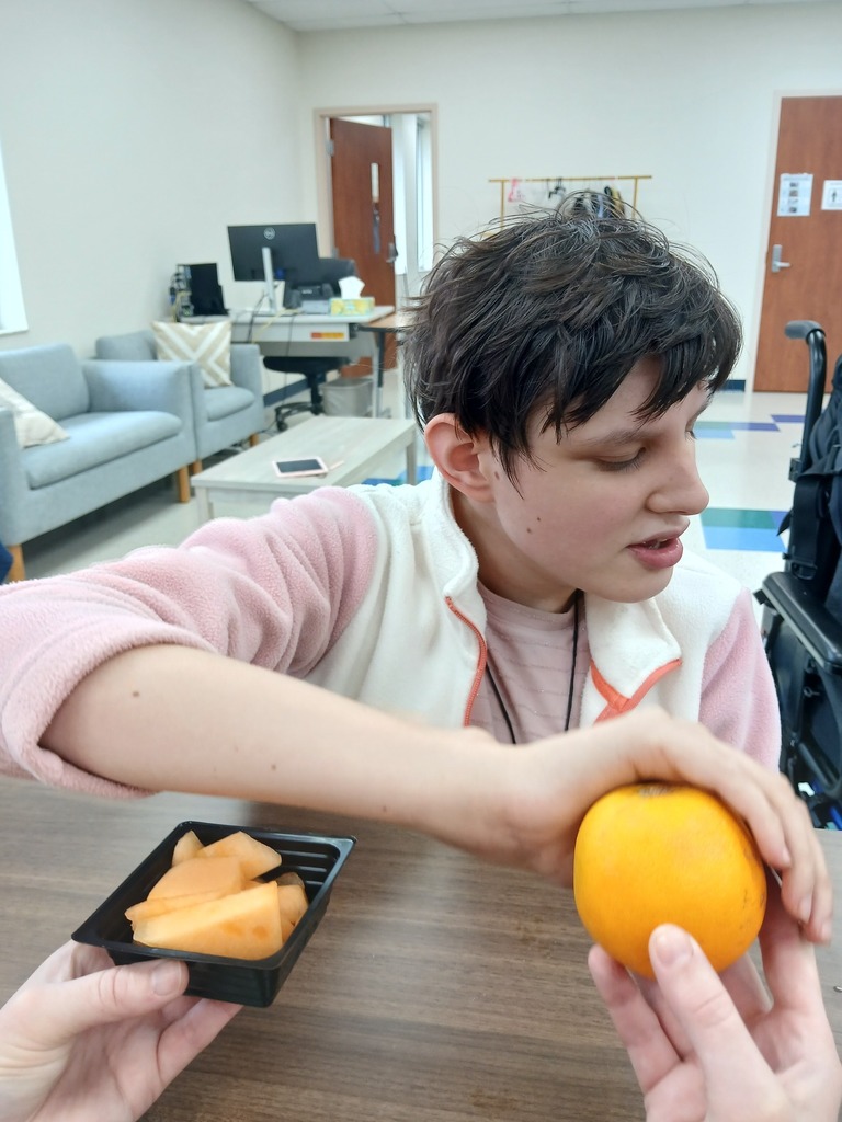 an intern choosing a fruit
