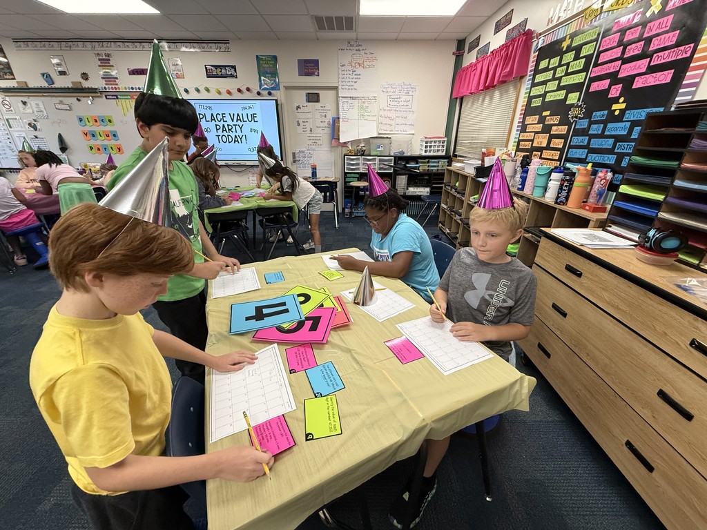 Students exploring place value with a party in the classroom