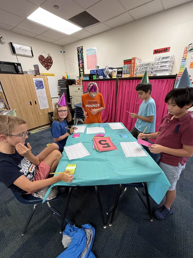 Students exploring place value with a party in the classroom