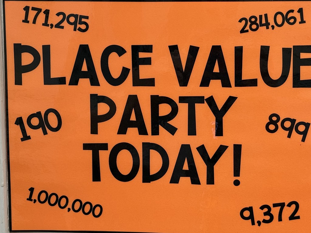 Students exploring place value with a party in the classroom