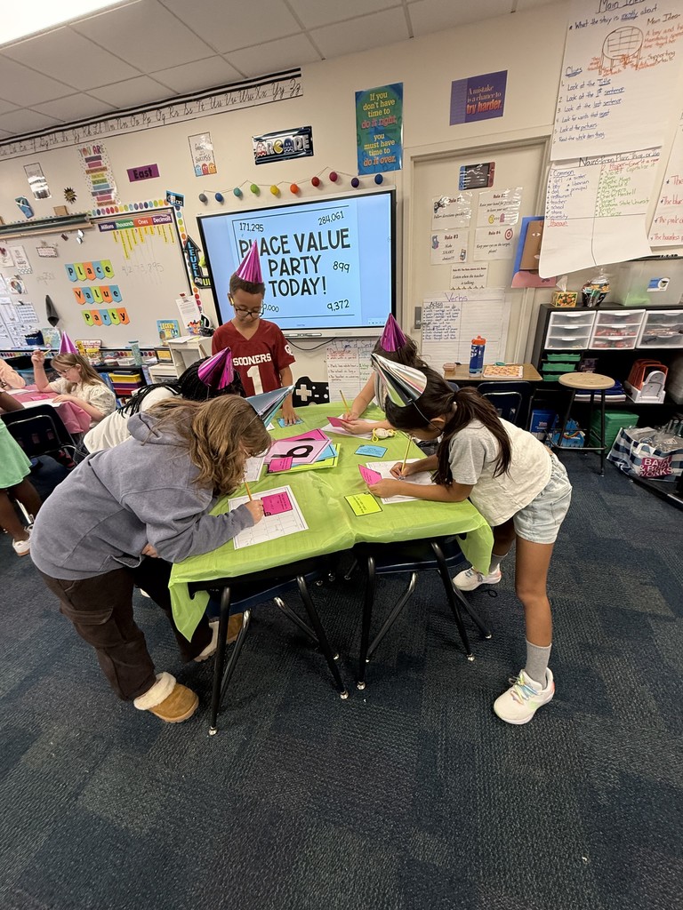 Students exploring place value with a party in the classroom