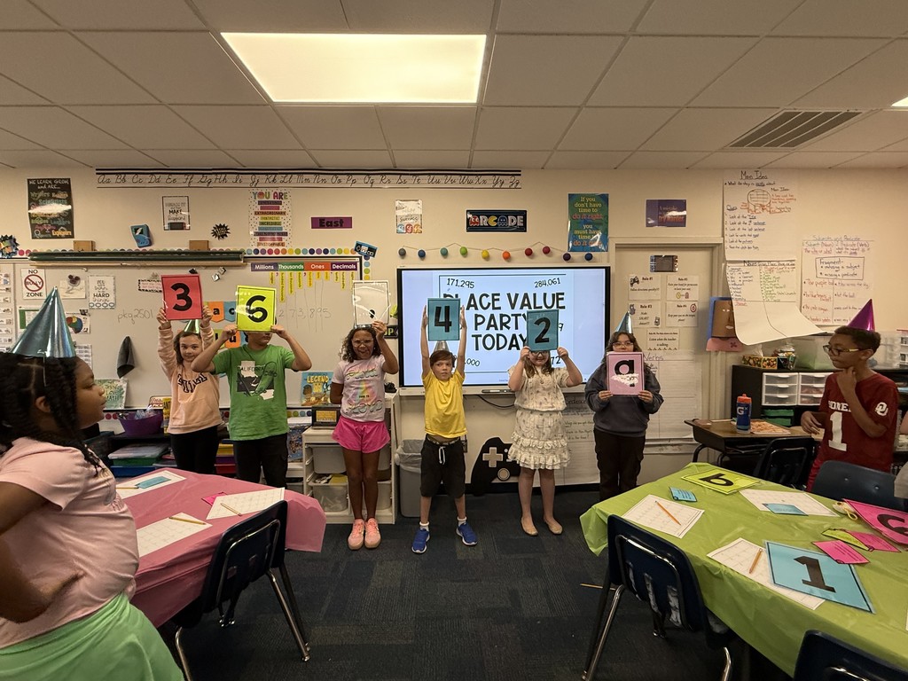 Students exploring place value with a party in the classroom
