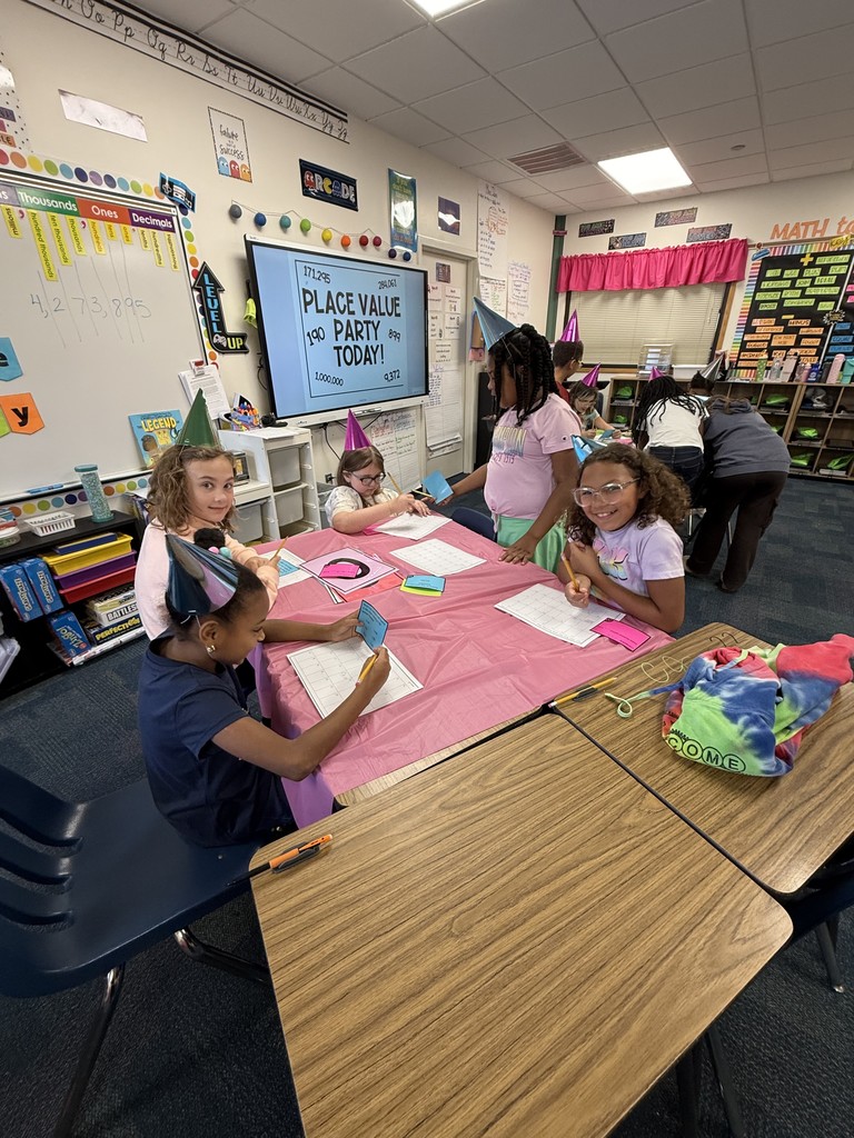 Students exploring place value with a party in the classroom