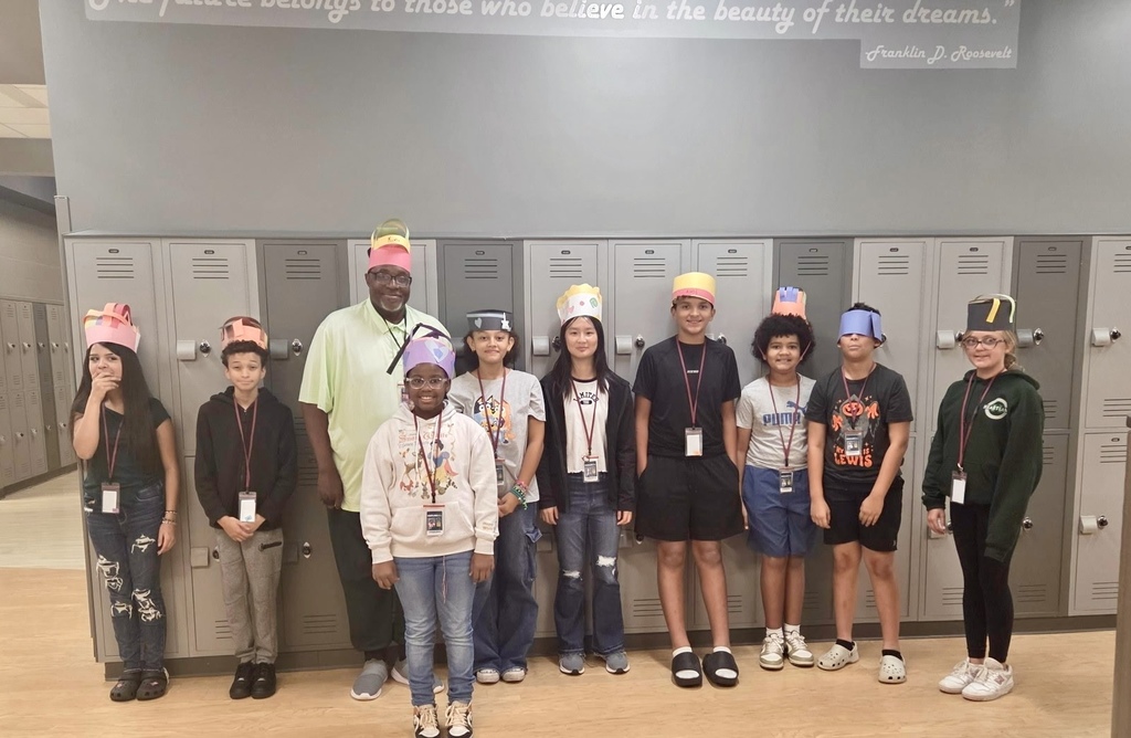 students standing with teacher