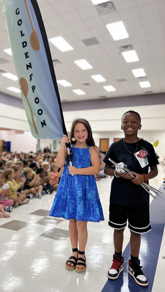 students and golden spoon flag