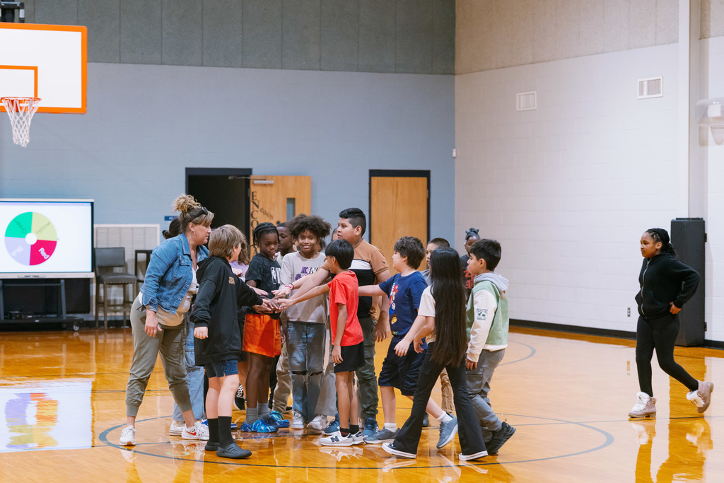 students stretching in gym class