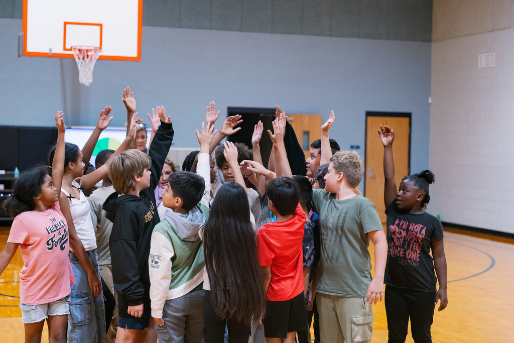 students stretching in gym class