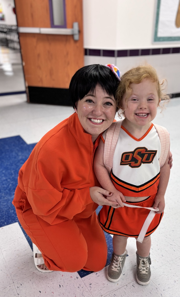 pre-K student and teacher dressed in americas brightest orange 