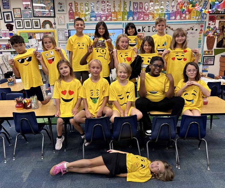 a whole lot of students dressed as emojis 