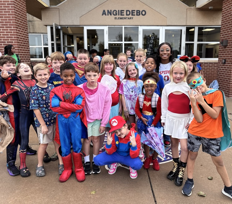 kids dressed up in hero costumes 