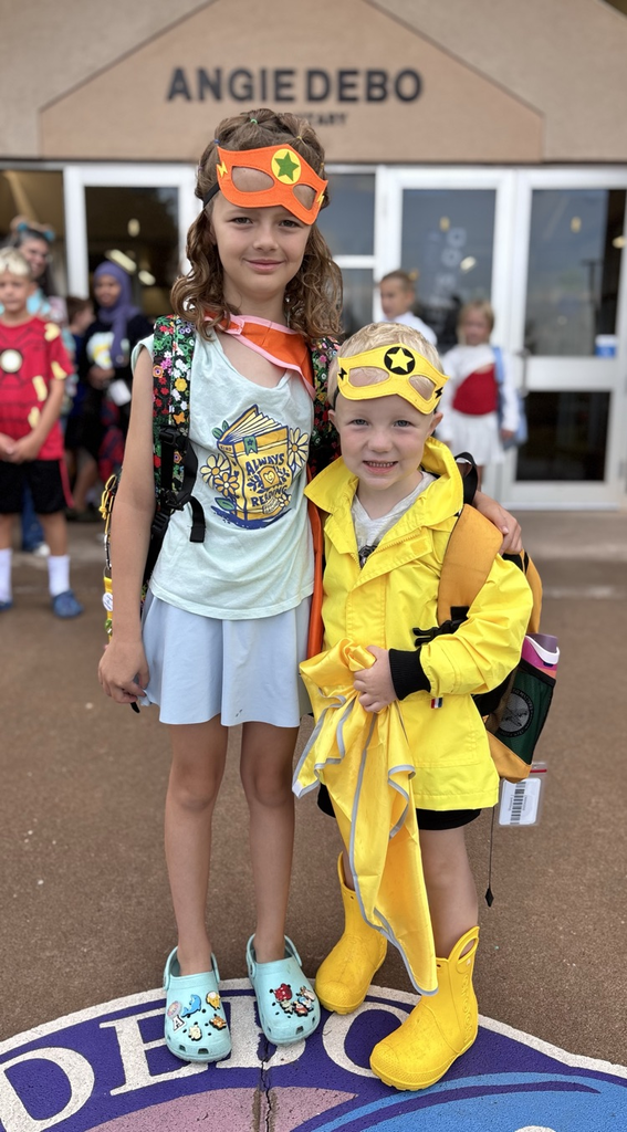 siblings dressed up in hero gear 