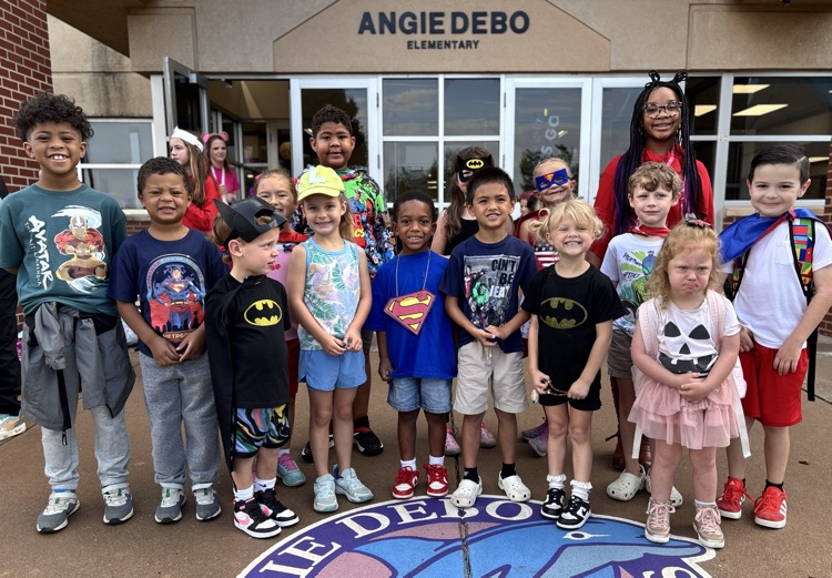 big group of kids dressed up in hero attire 