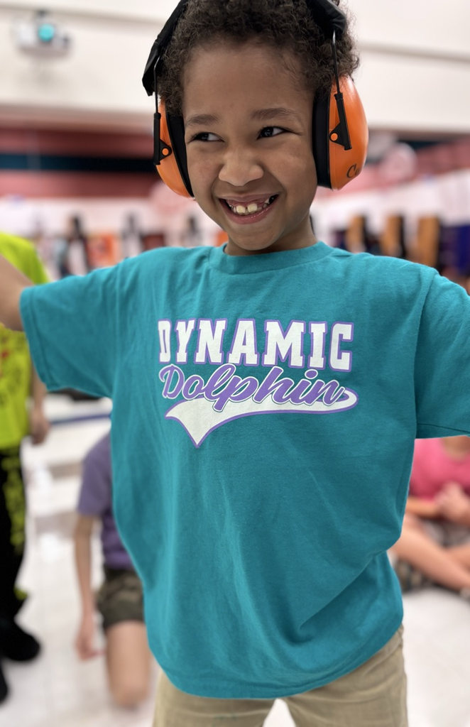 student in dynamic dolphin shirt 