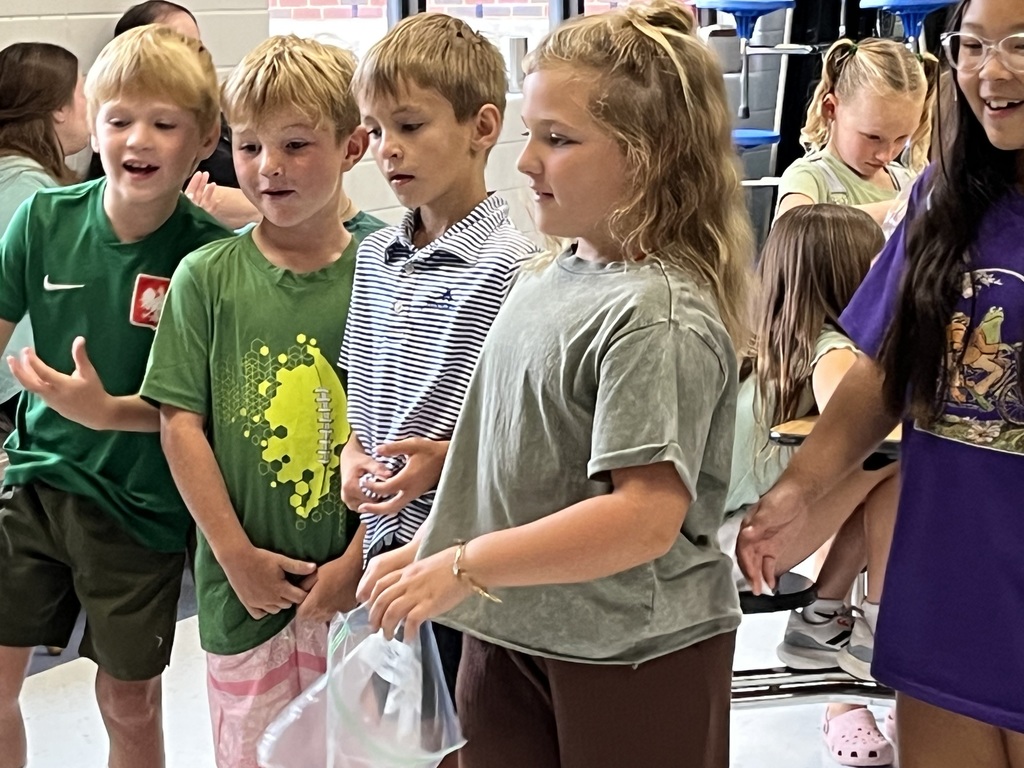 Second graders playing frog toss