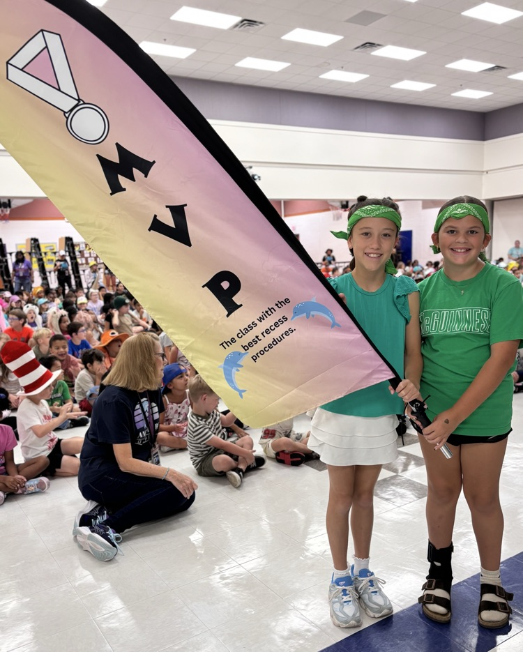 students holding mvp flag