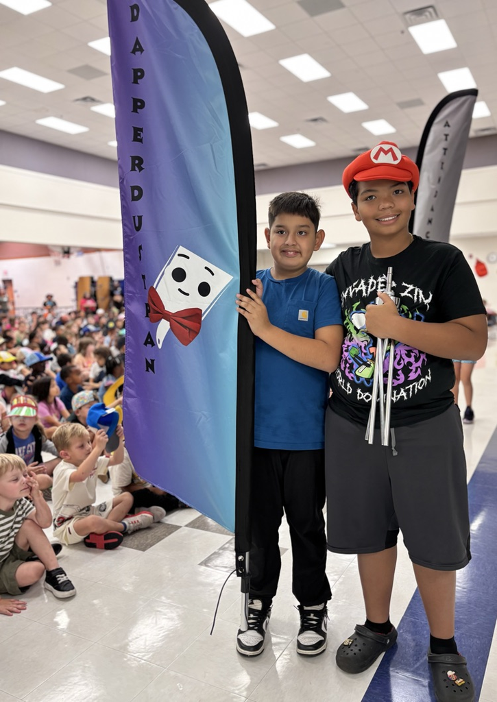 Students holding dapper dustpan flag