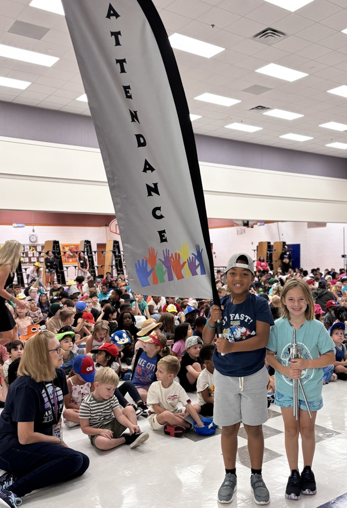 students holding attendance flag 