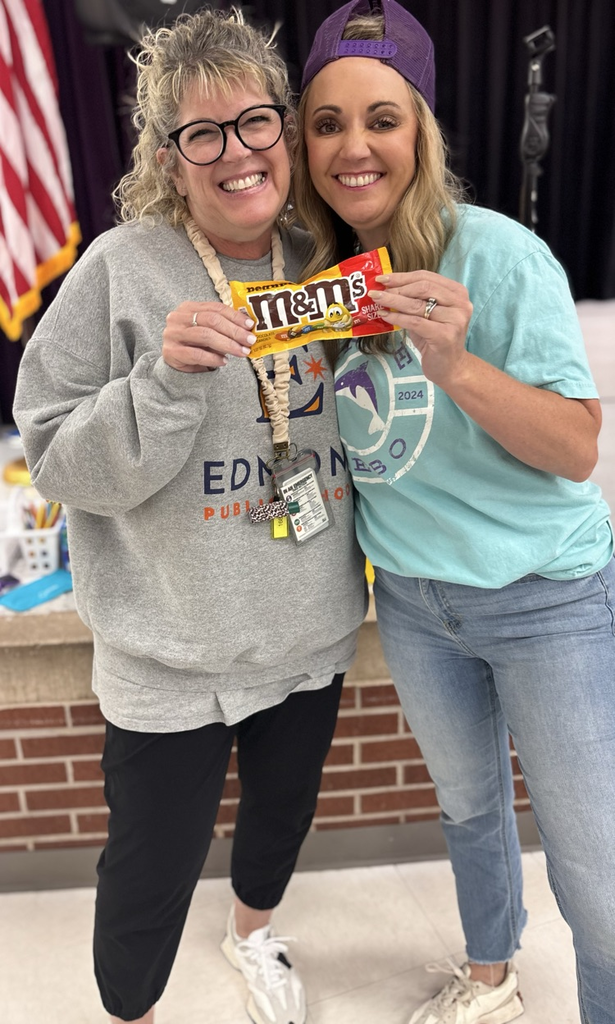 Mrs. lipps getting M&Ms from Mrs Williams 