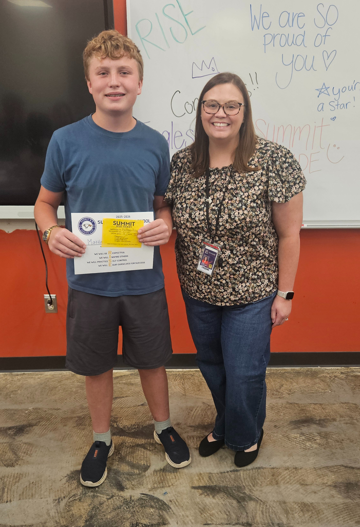 Mrs. Mendenhall stands next to the student she nominated for Eagle's Nest.