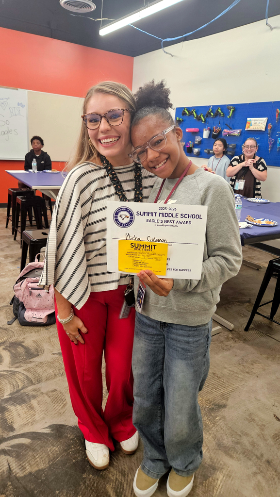 Ms. Poplin stands next to the student she nominated for Eagle's Nest.