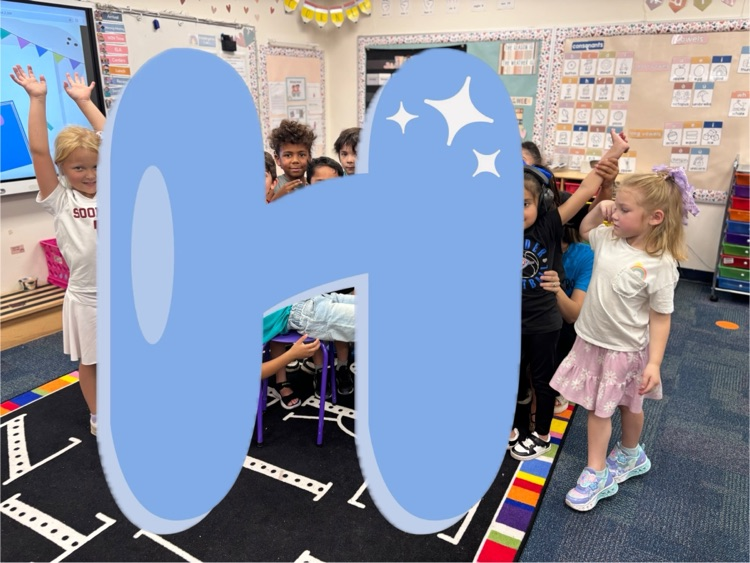 kinder students making the letter h with an h graphic covering the students who are the h