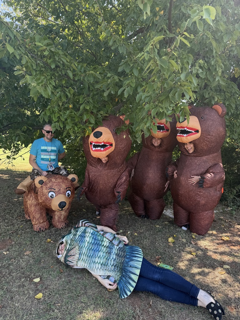 teachers in inflatable bear and fish costumes