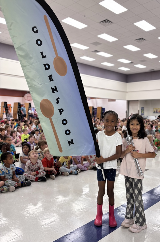students with golden spoon flag 