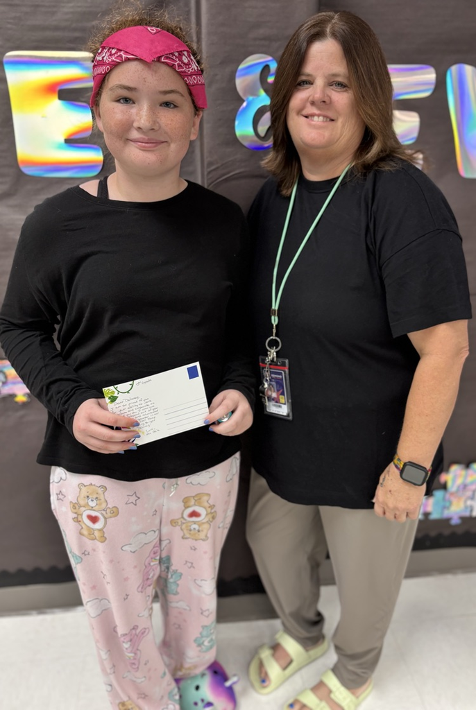 student with Mrs hale receiving a postcard 