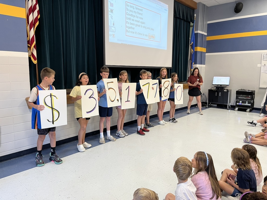 Students reveal fundraiser money earned.