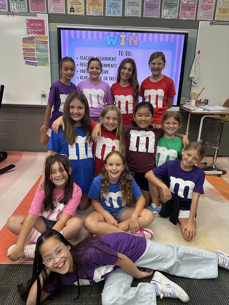Group of girls in matching outfits smiling