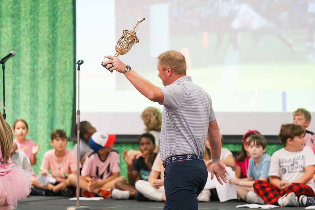 brandon weeden holding trophy up