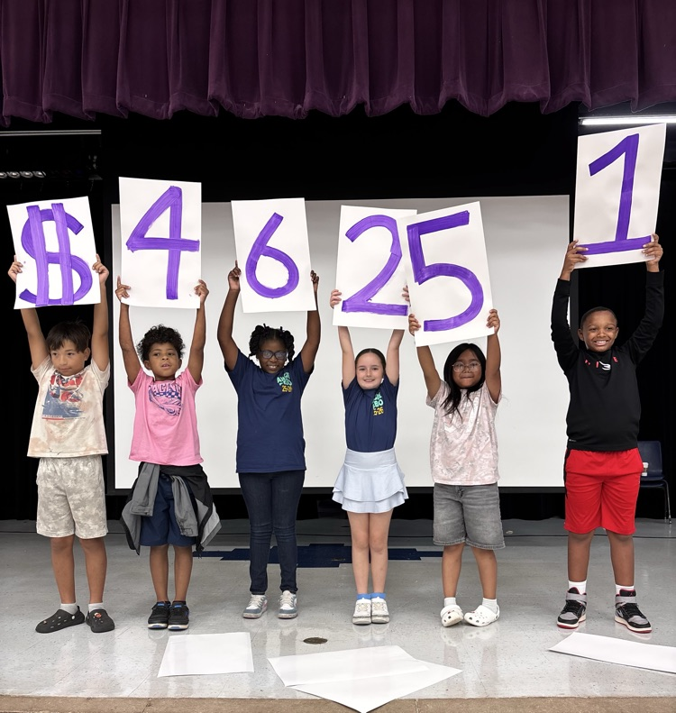 students holding up 46000 dollar sign 
