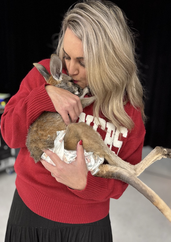 Mrs Williams kissing a Joey 