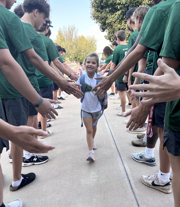 student walking through high school tunnel into school 
