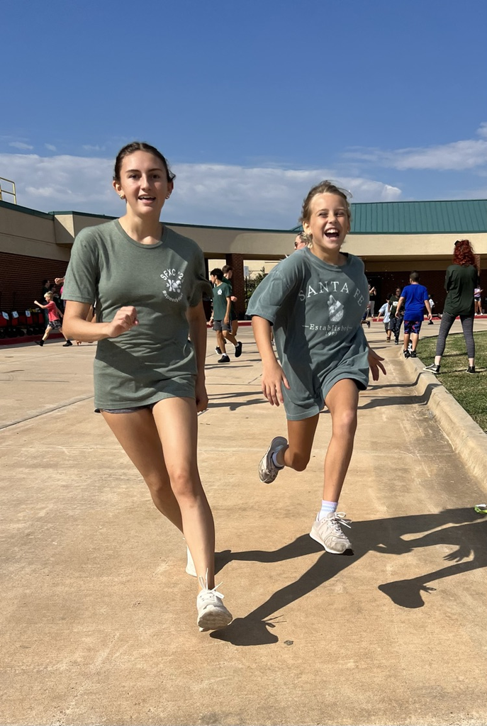 student running with high school buddy 