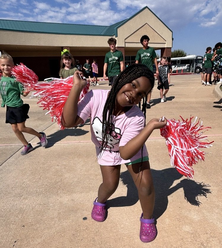 student running with Pom poms 